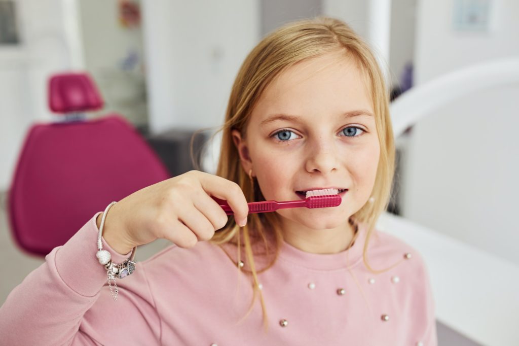 Girl Brushing Teeth at Kids Smiles Pediatric Dentistry Best in St. Louis, MO