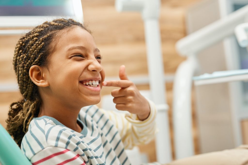 Child Pointing To Teeth at Kids Smiles Pediatric Dentistry Best in St. Louis, MO