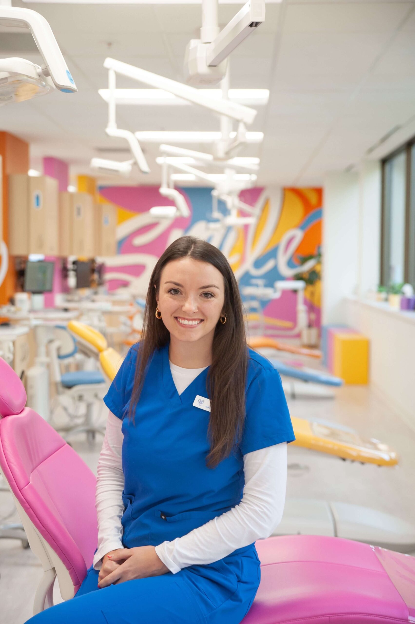Brigid, patient care and frenectomy coordinator at Kids Smiles Pediatric Dentistry, guiding families through specialized pediatric services.
