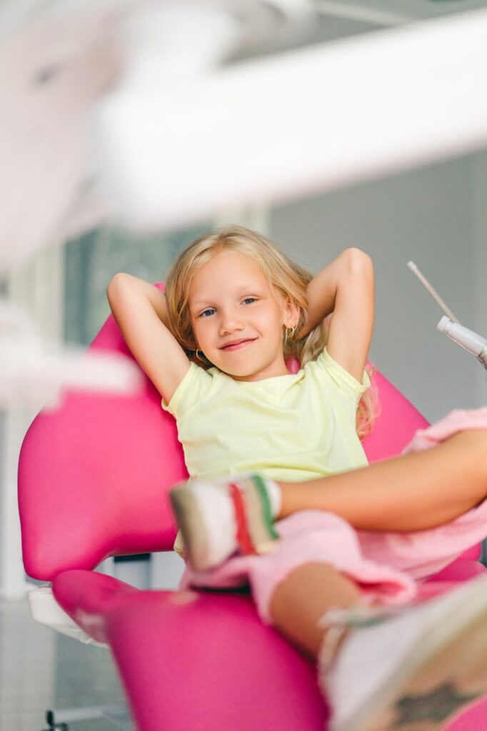 St. Louis pediatric dentist placing a stainless steel crown on a child's tooth at Kids Smiles Pediatric Dentistry.